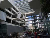 Auditorium at IT University Copenhagen, a high room with cubic architecture.